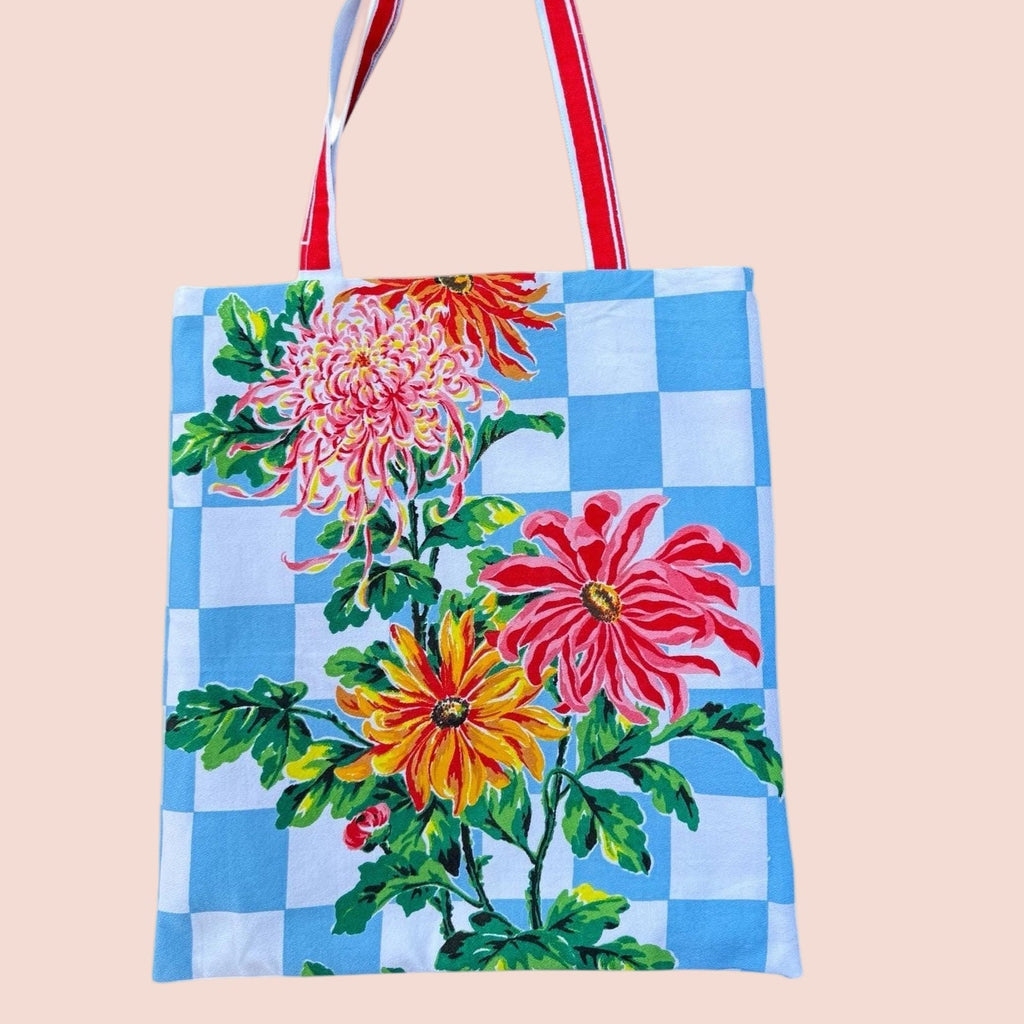 Tote bag with floral design on a blue checkered background